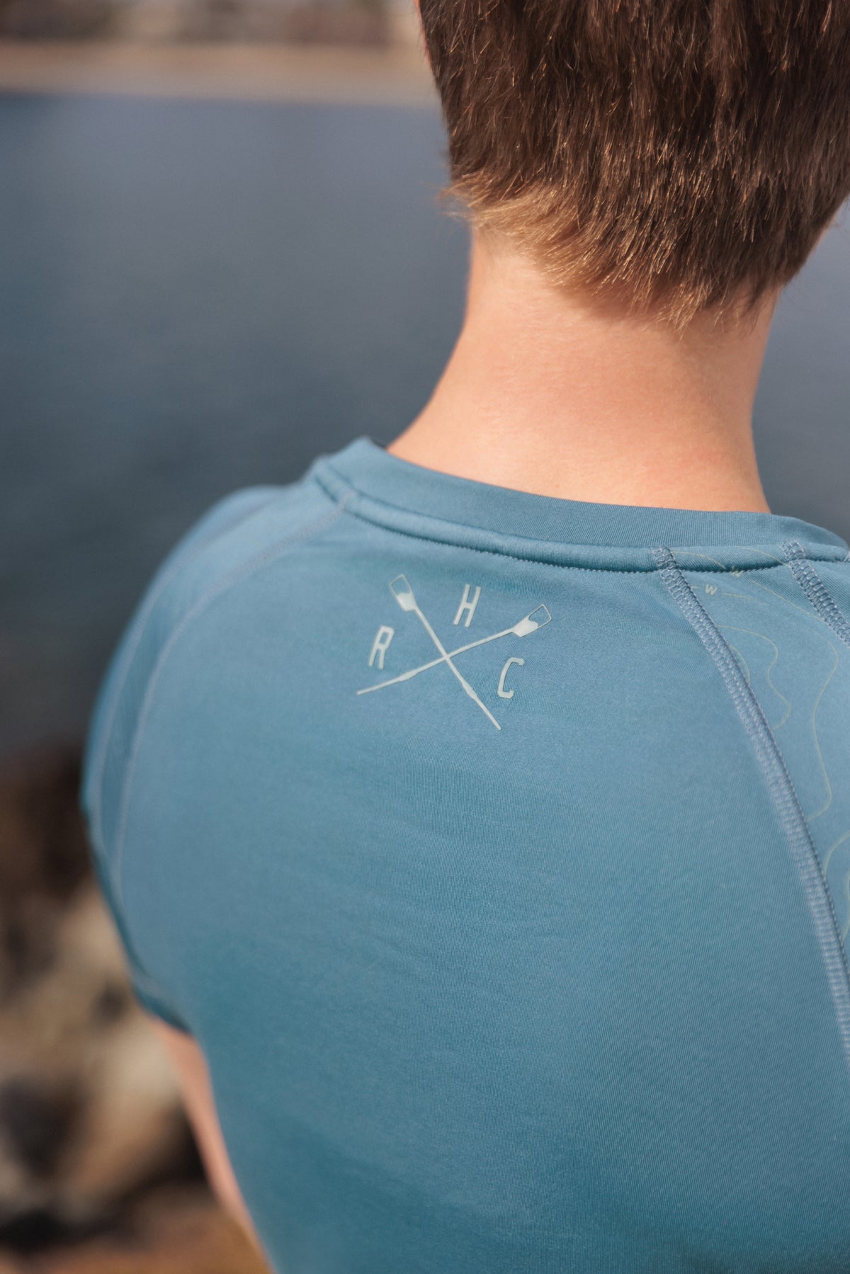 mositure wicking compression tee in gray with hrc crossed oar logo on back between shoulders