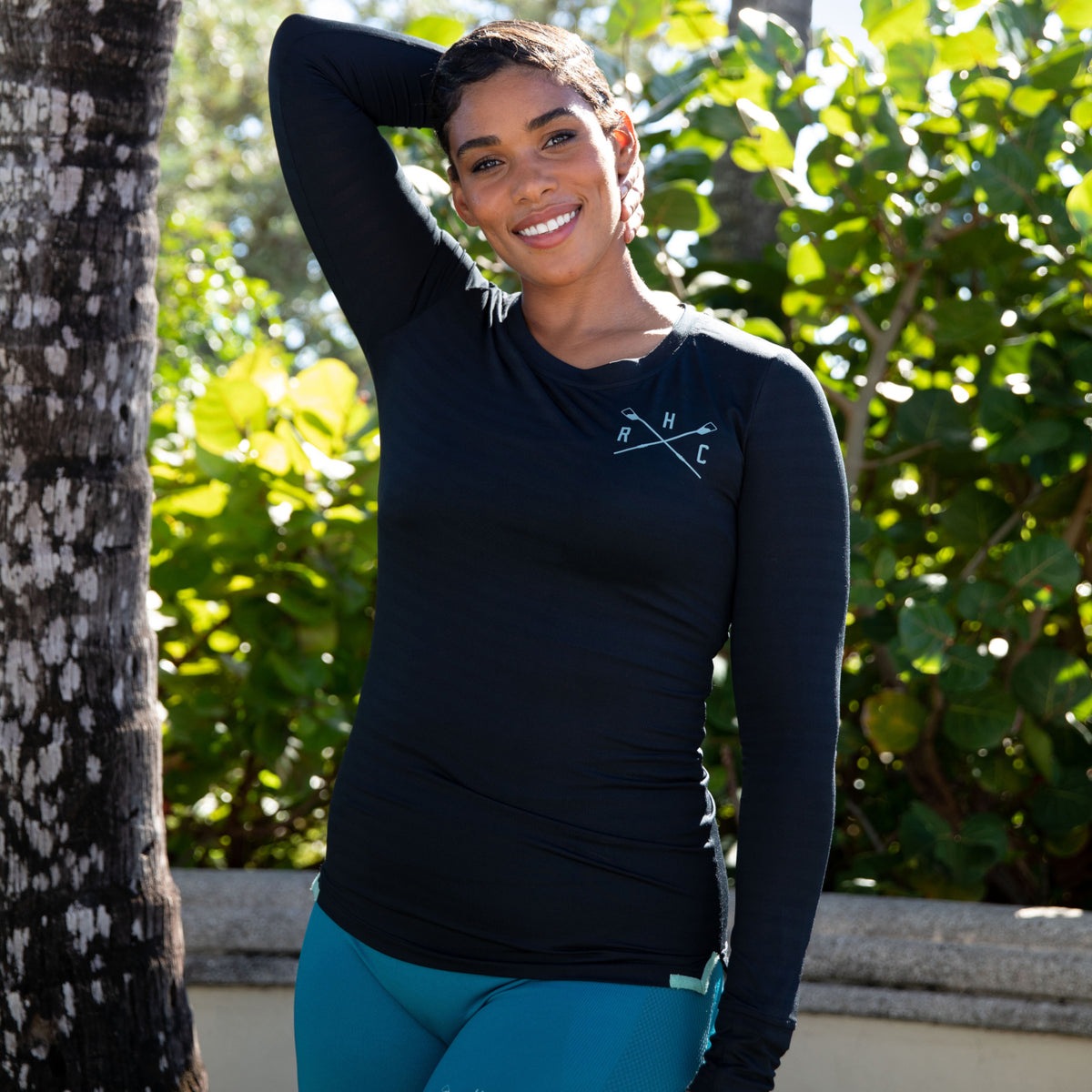 woman posing in breathable knit long sleeve crew