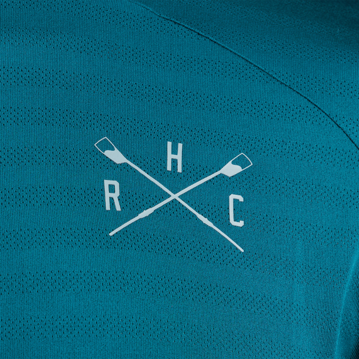 Zoomed in hyrdow crossed oars logo on dark blue background