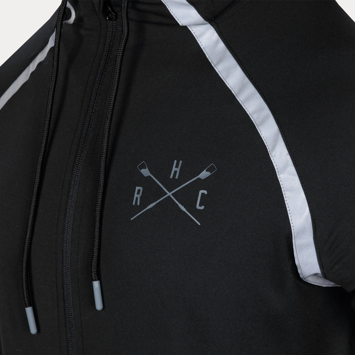 closeup of crossed oar logo on left chest of full zip jacket