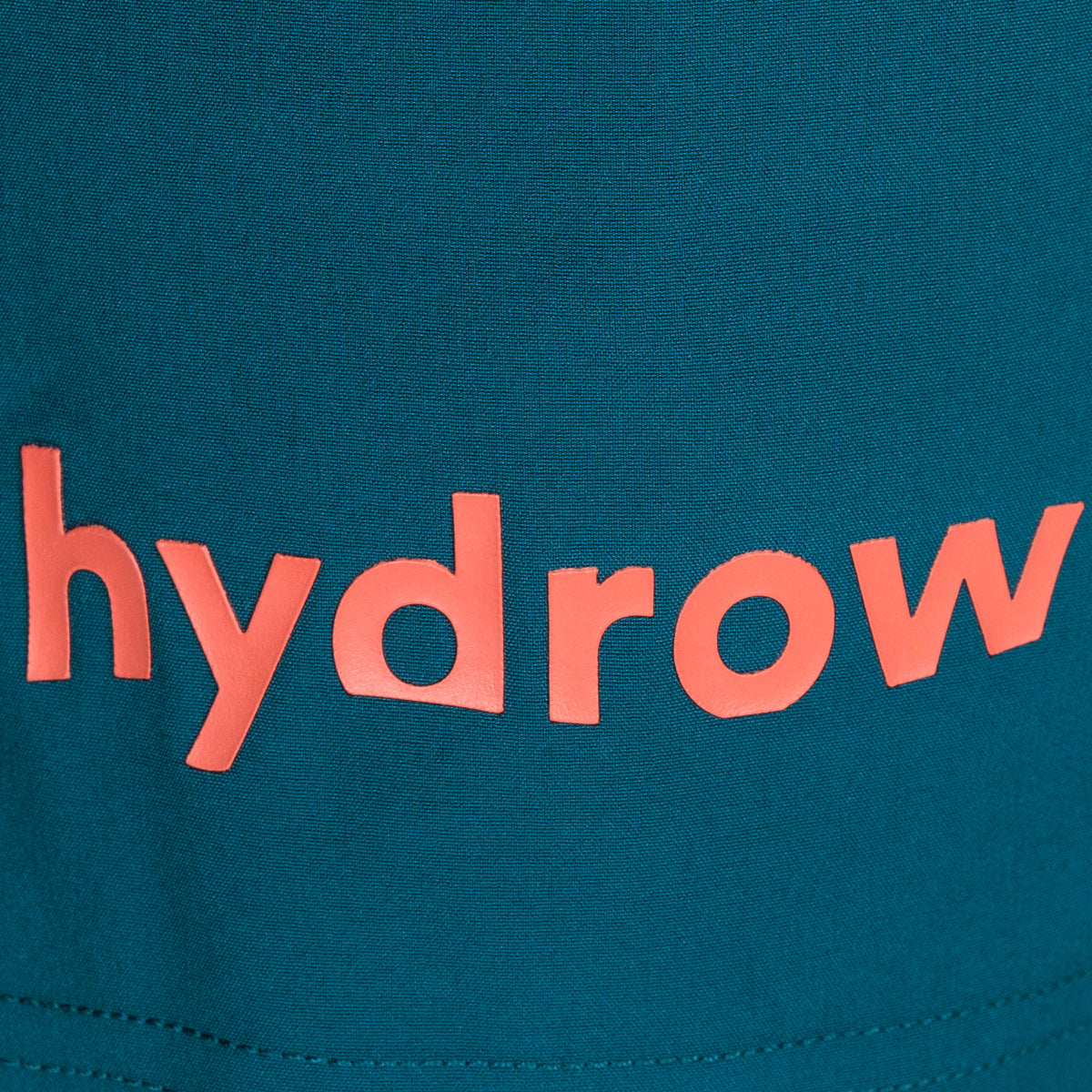 orange hydrow logo on dark blue shorts