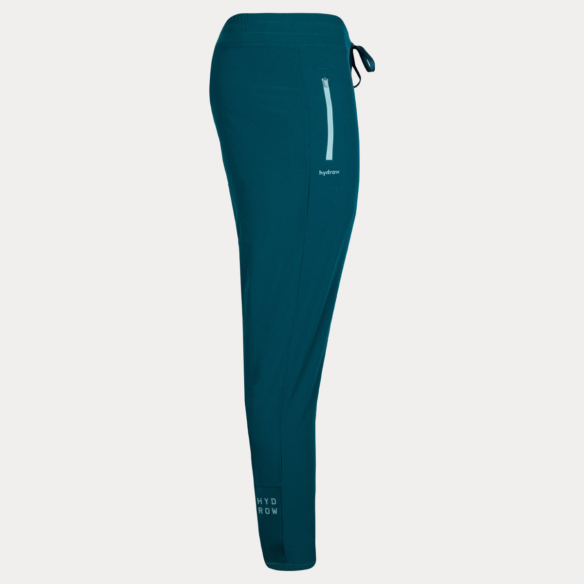 side view of dark blue unisex rowing pant showing hydrow logo on ankle