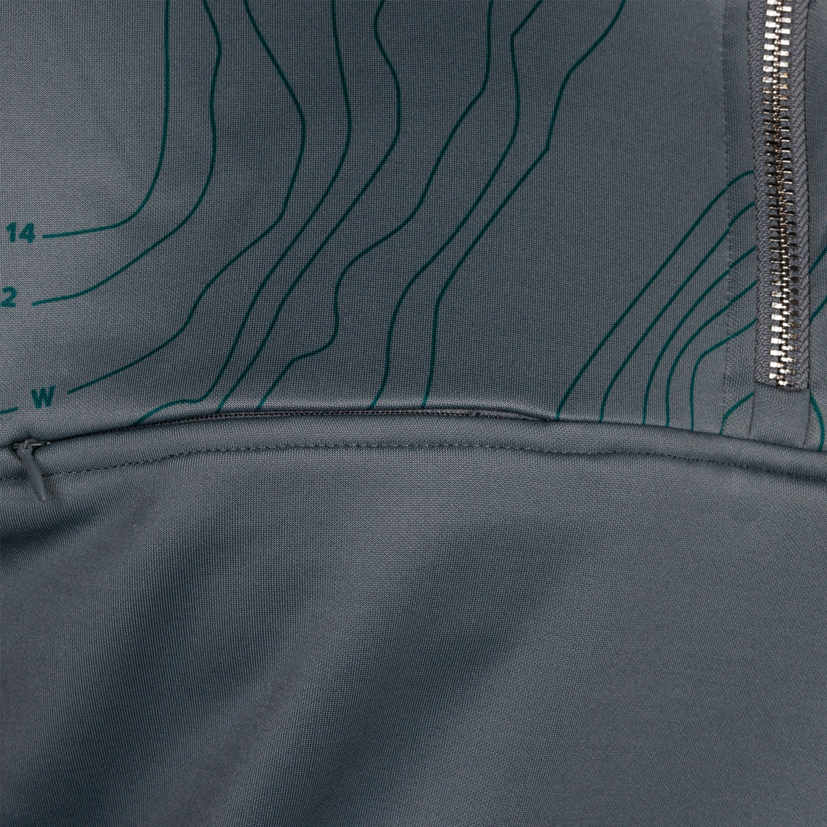 closeup of chest pocket of 1/4 zip pullover