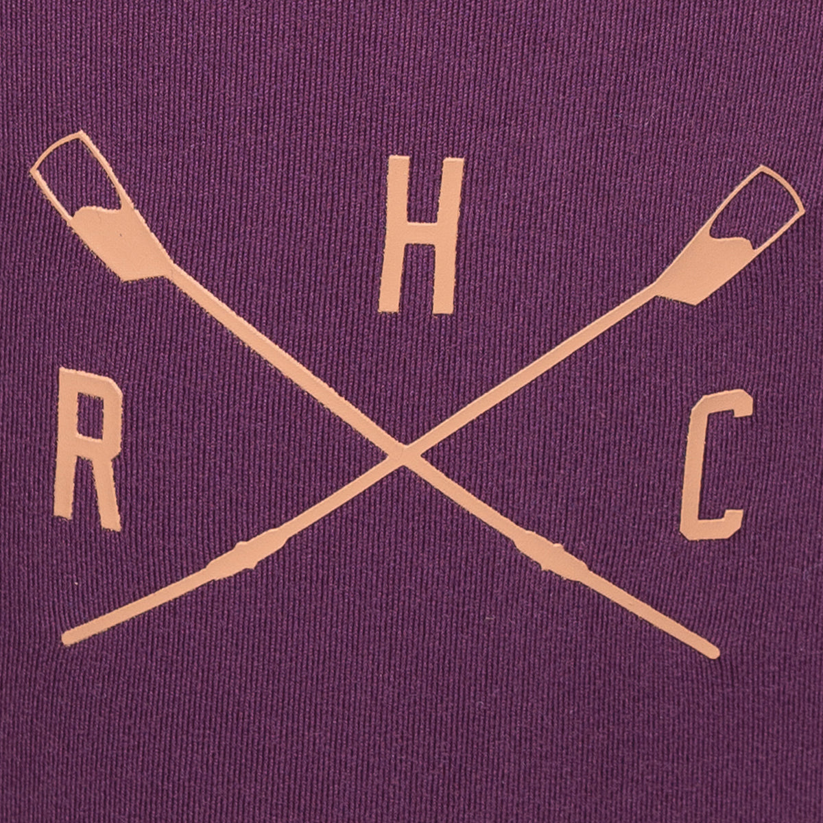 closeup of crossed oars logo on plum leggings