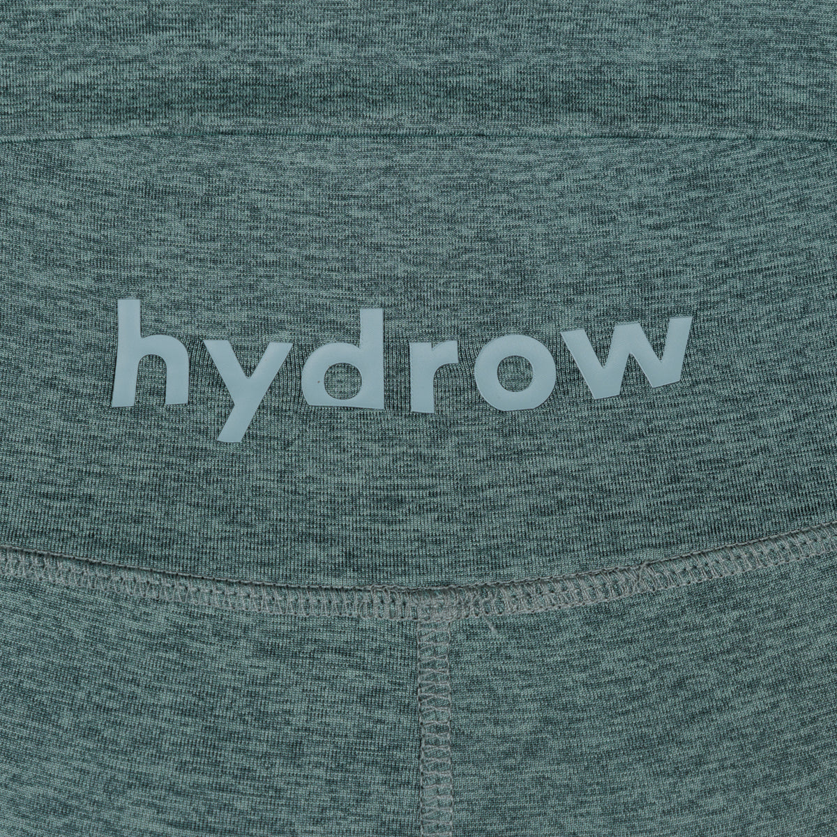 zoomed in hydrow logo on rear pocket of forest green heathered leggings